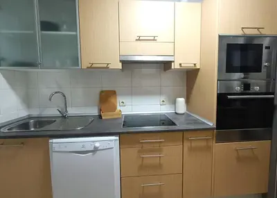 Una cocina o zona de cocina en Alkan Suites con terraza en 1º linea de playa y piscina
