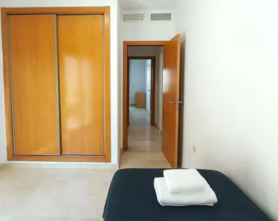 Cama o camas de una habitación en Alkan Suites con terraza en 1º linea de playa y piscina