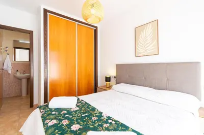 Cama o camas de una habitación en Apartamento con terraza y piscina en Los Collados - By Aloha Palma