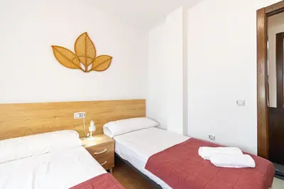 Cama o camas de una habitación en Apartamento con terraza y piscina en Los Collados - By Aloha Palma