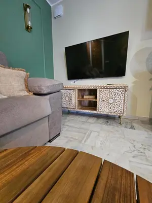 Una televisión o centro de entretenimiento en Vera Apartamento Perla Esmeralda