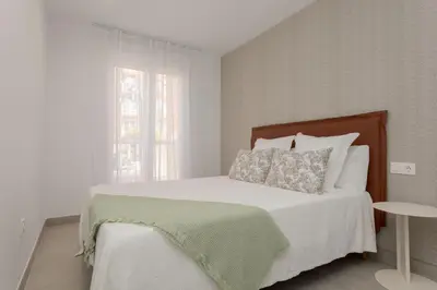 Cama o camas de una habitación en Apartamento Exclusivo Frente al Mar