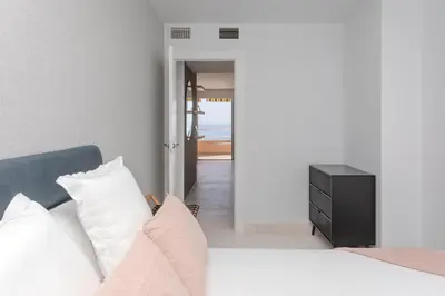Cama o camas de una habitación en Apartamento Exclusivo Frente al Mar