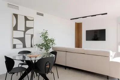 Una televisión o centro de entretenimiento en Apartamento Exclusivo Frente al Mar