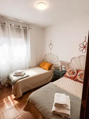 Cama o camas de una habitación en Apartamento con acogedora terraza