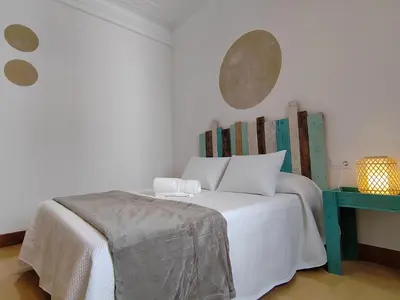 Cama o camas de una habitación en Apartamentos Bertrand Plaza