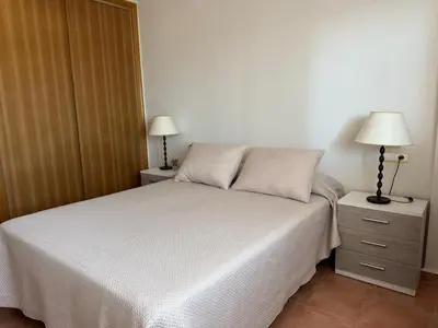 Cama o camas de una habitación en Atico con vistas al mar