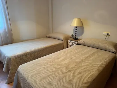 Cama o camas de una habitación en Atico con vistas al mar