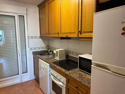 Una cocina o zona de cocina en Atico con vistas al mar