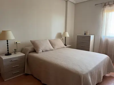 Cama o camas de una habitación en Atico con vistas al mar