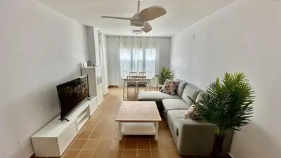 Una televisión o centro de entretenimiento en Ático Dúplex con vistas al Mar