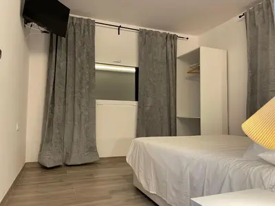 Cama o camas de una habitación en Villa Rosa