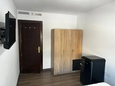 Una televisión o centro de entretenimiento en Mi Huésped El Ejido