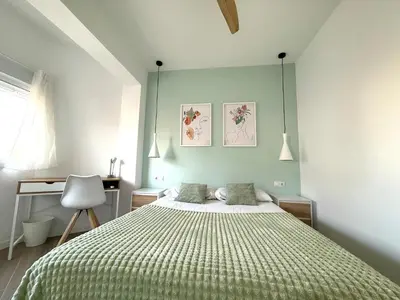 Cama o camas de una habitación en Alma Y Arena Beach Apartment