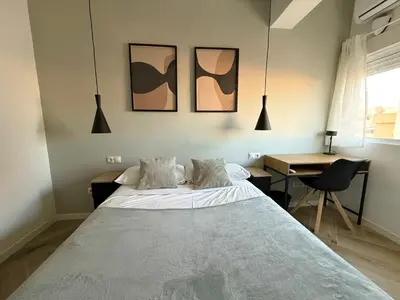 Cama o camas de una habitación en Alma Y Arena Beach Apartment