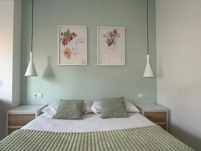 Cama o camas de una habitación en Alma Y Arena Beach Apartment