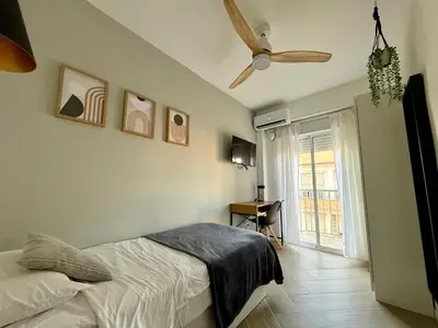 Cama o camas de una habitación en Alma Y Arena Beach Apartment