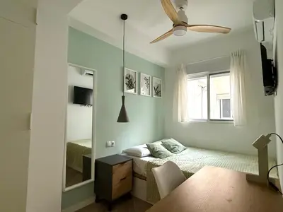Una televisión o centro de entretenimiento en Alma Y Arena Beach Apartment