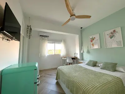Cama o camas de una habitación en Alma Y Arena Beach Apartment