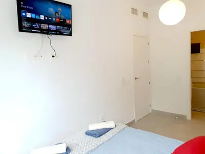 Una televisión o centro de entretenimiento en Apartamento Brisas Luminosas