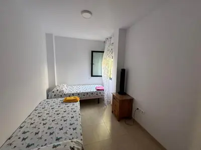 Cama o camas de una habitación en apartamento vacacional roquetas de mar