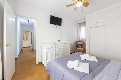 Cama o camas de una habitación en AlmeriaSuite Playa Serena Roquetas