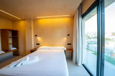 Cama o camas de una habitación en Hotel Boutique MANANTIAL DE CELA
