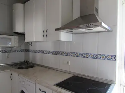 Una cocina o zona de cocina en VERA PLAYA CON PISCINA, TERRAZA y SOLARIUM