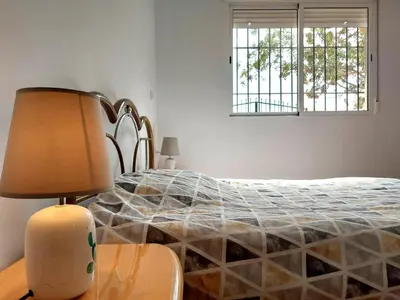 Cama o camas de una habitación en Casa rural Alborania con jardín, aparcamiento, tranquilo, entre el mar y el desierto