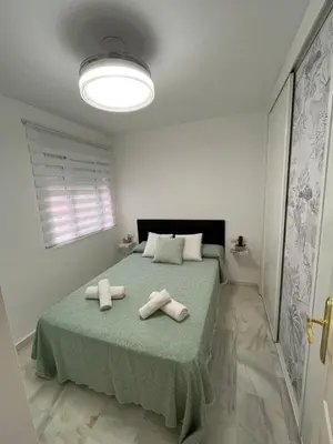 Cama o camas de una habitación en Ático Sol y Mar