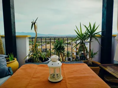 Un balcón o terraza de Ático premium con vistas al mar y a la laguna del Salar