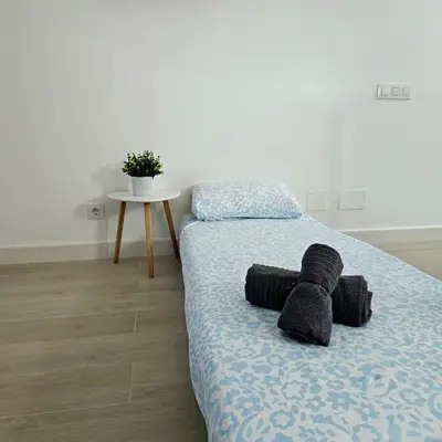 Cama o camas de una habitación en Encantador apartamento y terraza