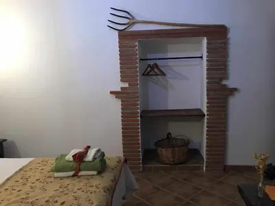 Cama o camas de una habitación en Cortijo Rural Bacares