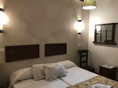 Cama o camas de una habitación en Cortijo Rural Bacares