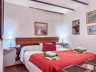 Cama o camas de una habitación en Cortijo Rural Bacares