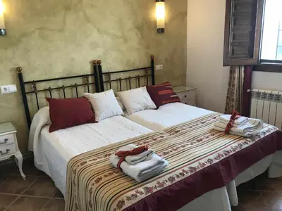 Cama o camas de una habitación en Cortijo Rural Bacares