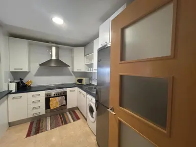 Una cocina o zona de cocina en Apartamento con Terrazas y vistas al mar