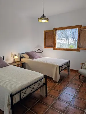 Cama o camas de una habitación en El Cortijo Escondido Ohanes