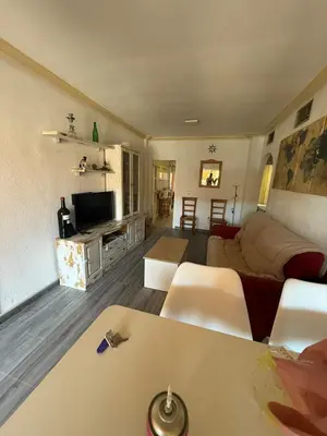 Una televisión o centro de entretenimiento en Apartamento marina de la torre