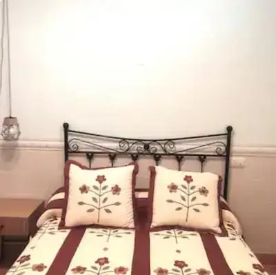 Cama o camas de una habitación en The Holiday House San Jose