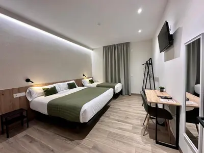 Cama o camas de una habitación en Hotel Síbel Baza