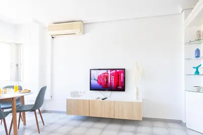 Una televisión o centro de entretenimiento en Fantástico apartamento en el centro y junto a la playa - By Aloha Palma