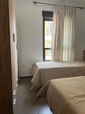 Cama o camas de una habitación en Costa & Confort Apartamentos
