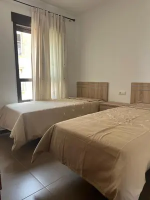 Cama o camas de una habitación en Costa & Confort Apartamentos