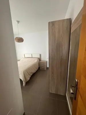 Cama o camas de una habitación en Costa & Confort Apartamentos