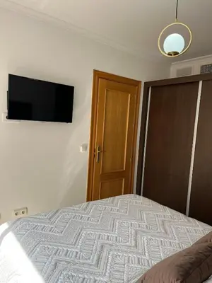 Cama o camas de una habitación en Piso acogedor con vistas al mar