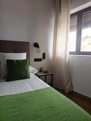 Cama o camas de una habitación en La Troje Pensión