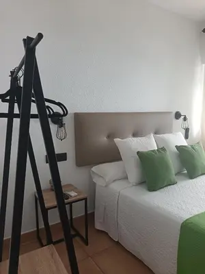 Cama o camas de una habitación en La Troje Pensión