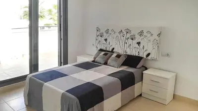 Cama o camas de una habitación en Apartamento a 200 m del mar con piscina y padel