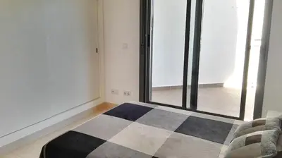 Cama o camas de una habitación en Apartamento a 200 m del mar con piscina y padel